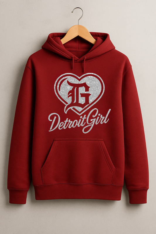 Cardinal red hoodie on hanger featuring silver glitter heart logo with gothic “G” and script text reading Detroit Girl.