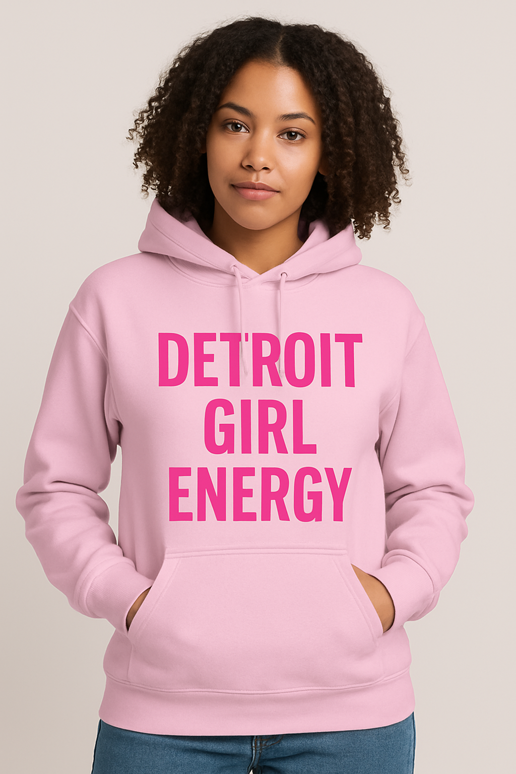 Model wearing a light pink hoodie