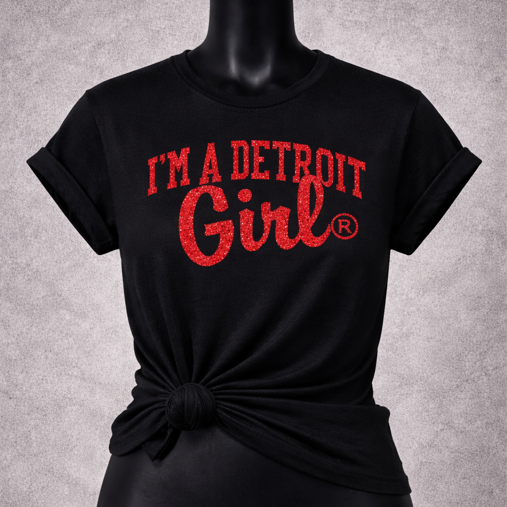 Black t-shirt with 'I'm a Detroit Girl' text on a mannequin against a gray background
