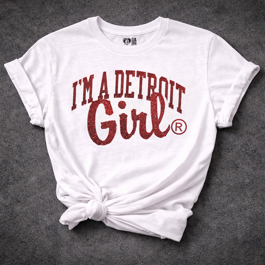 White t-shirt with 'I'm a Detroit Girl' text on a dark gray background